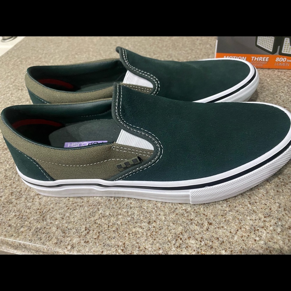 Mens vans green slip ons. Never worn. New without tags